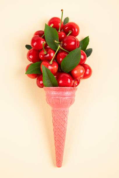 Cherry fruits in an ice cream cone