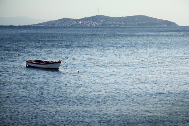 istock Small boat resting in the calm water 2154924913