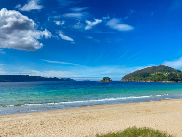 istock Empty paradisiacal beach with an island in the background 2154925538