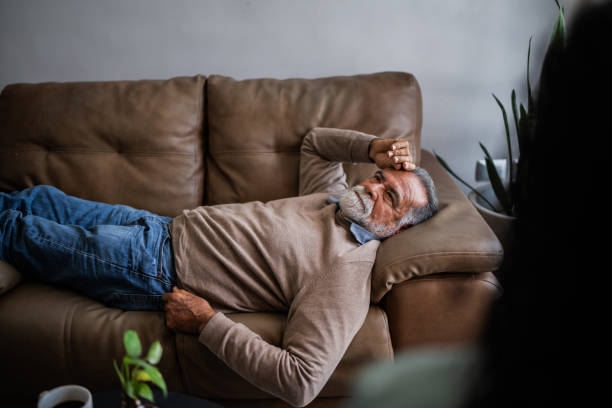 istock Senior man talking with pshychotherapist during therapy session at clinic 2154926290