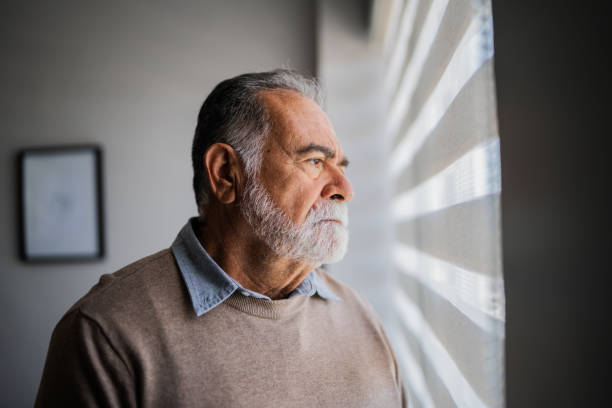 istock Senior man contemplating at home 2154926384