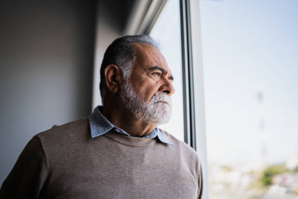 istock Senior man contemplating at home 2154926387
