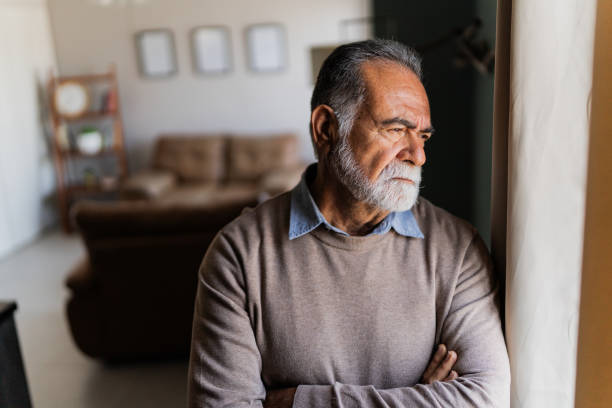 istock Senior man contemplating at home 2154926394