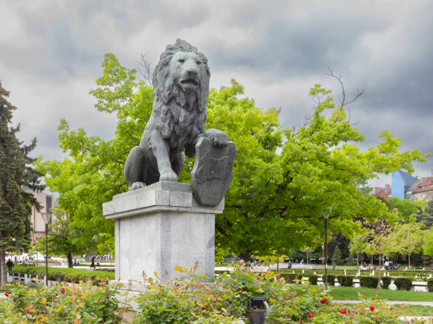 Lion sculpture at Monument to Alfonso XII in Buen Retiro park, Madrid, Spain