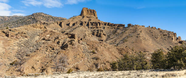 istock Hoodoos rock formations in the Absaroka mountain range, Absaroka-beartooth Wilderness, near Cody, Wyoming. Shoshone National Forest with the Eocene Wapiti volcanics also called the Absaroka Volcanic Province.  Made up of volcaniclastic sedimentary rock. 2154927865