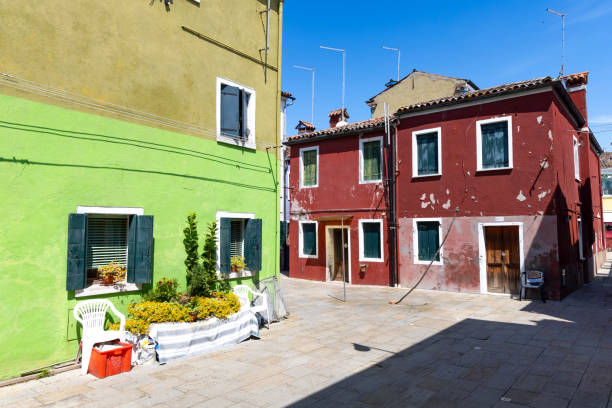 Yellow and green houses. Colorful architecture in Burano island near Venice, Italy