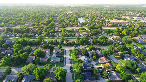 istock Lakeside master planned community with concrete channels facilitates drainage from streets discharge into creek, flood storage capacity to waterway dredging drain in suburbs Dallas, Texas, aerial 2154929802