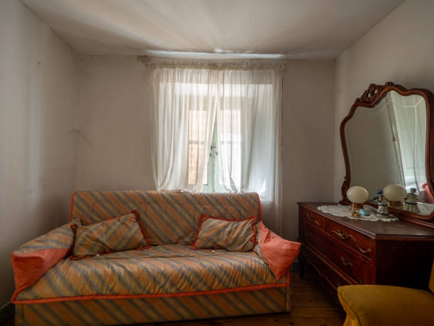 istock A small room with a couch and a dresser 2154930654