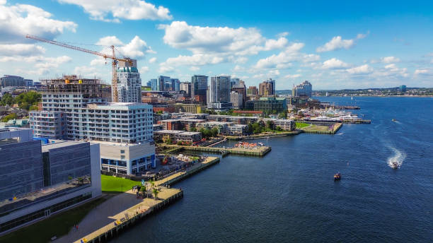 Halifax, Canada - August, 2023: Drone shot of the Halifax Harbour, showing the waterfront and a part of Citadel Hill, as well and the Discovery Centre and the Angus L. Macdonald Bridge.