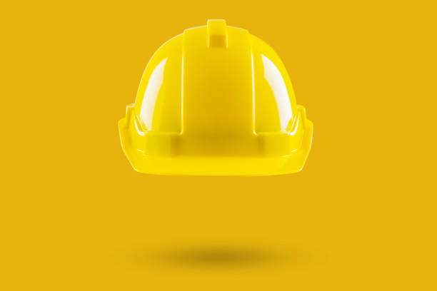 istock Safety construction helmet on yellow background 2154933516