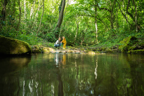 istock Eco Minded Kids. River Cleanup in Green Forest. 2154933690