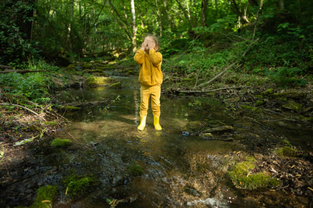 istock Green Mindset. Family Cleaning Riverbed in Forest. 2154933694