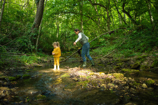 istock Eco Minded Kids. River Cleanup in Green Forest. 2154933706