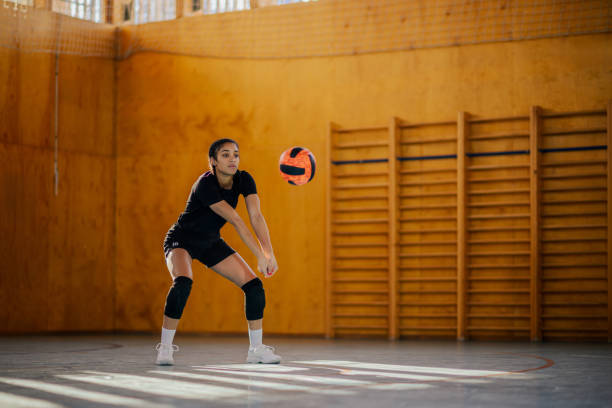 istock Multiracial young female volleyball player bumping a ball during a training 2154933849