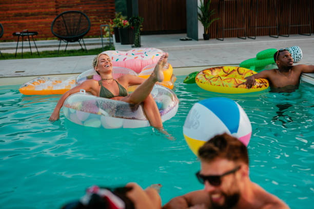 istock Blonde woman enjoying her time in a float in the pool 2154934081