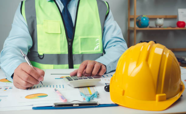 istock Architect or engineer sitting at desk in office, Cost calculation, Construction planning, structural calculation, Project construction cost planning and calculation, Project presentation plan. 2154937532