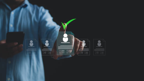 istock Human points finger at check mark, Human resources management concept. Check resume, Screening employee information, job applicants, Employees must complete the online survey form. 2154937538