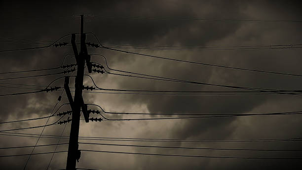 istock Power Lines Against Stormy Sky 2154939897