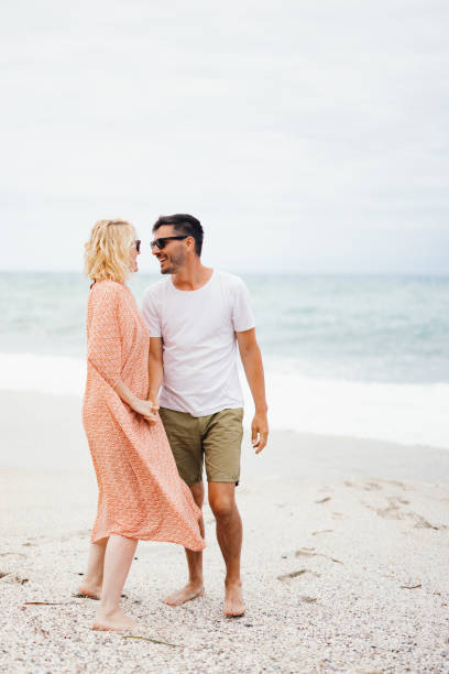 istock Happy Couple Enjoying a Day at the Beach 2154941513