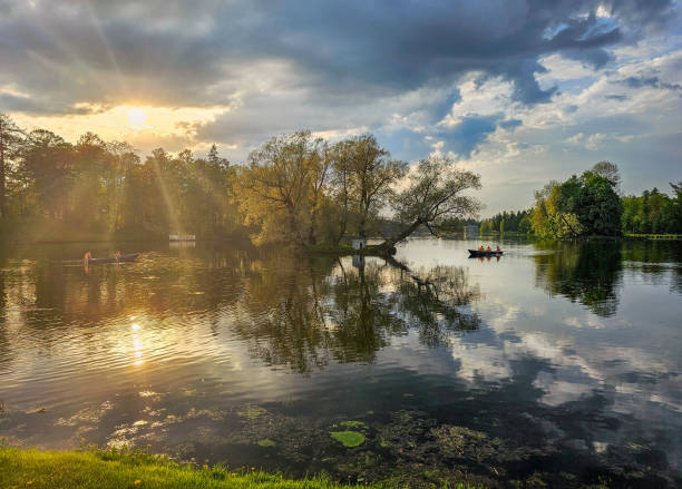 istock Beautiful spring view with sun over the lake and reflections in the water. 2154942221