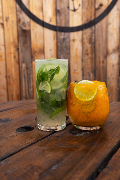 istock A tropical mojito and a passion fruit daiquiri with a rustic wooden background 2154944356
