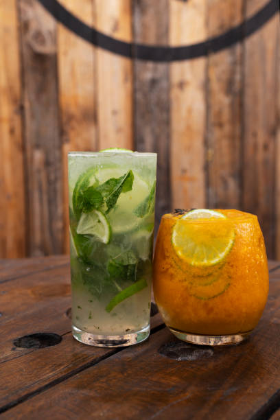 istock A tropical mojito and a passion fruit daiquiri with a rustic wooden background 2154944365
