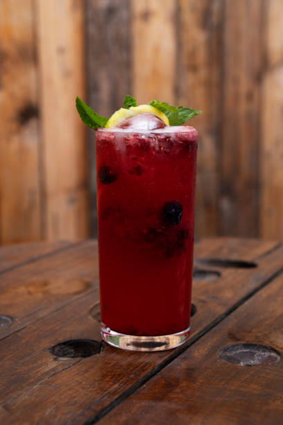 istock A tropical red berries daiquiri with a rustic wooden background 2154944377