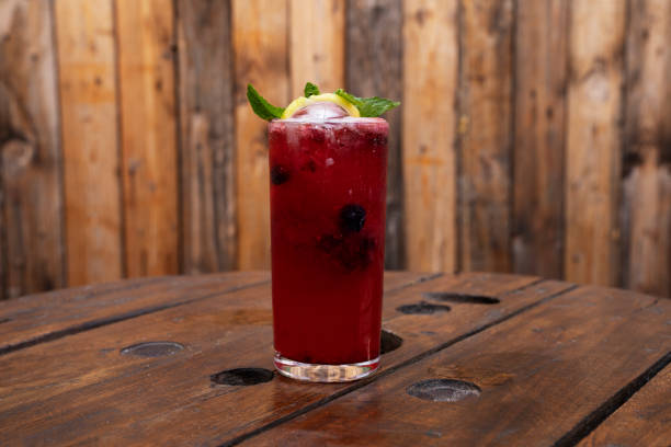 istock A tropical red berries daiquiri with a rustic wooden background 2154944433