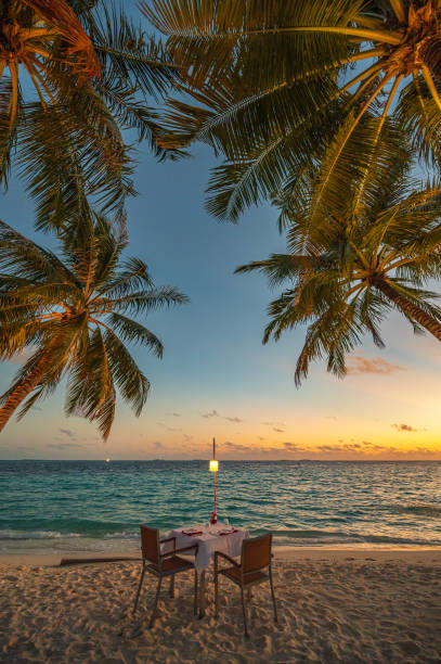 As the sun dips below the horizon, the sky transforms into a canvas of vibrant colors—shades of orange, pink, purple, and gold blend seamlessly, creating a mesmerizing view. The fading light casts a warm glow, painting the clouds and surroundings in a magical hue.