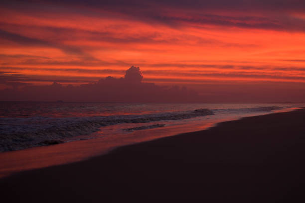 A dreamy, magical sunset. The sky seems to be on fire, the colors seem unreal, the landscape has a natural filter. The effect of the sunset light with the stormy clouds generate a surreal film atmosphere.