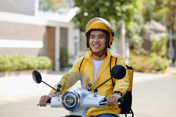 istock Delivery Man Riding Motorbike 2154947623