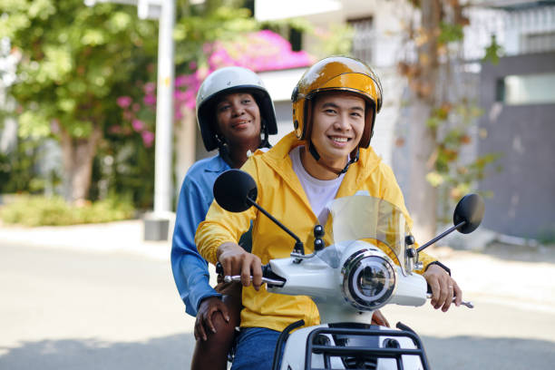 Smiling Motorbike Taxi Driver Portrait of smiling Vietnamese man working as motorbike taxi driver vietnamese man taxi motorbike driver stock pictures, royalty-free photos & images