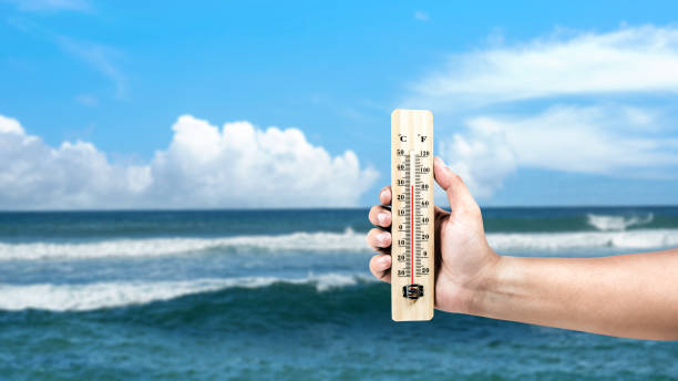 istock Human hand holding thermometer with hot temperature 2154947806
