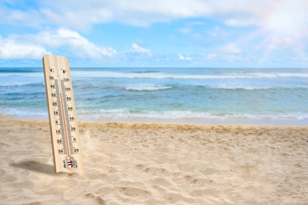 istock Thermometer with hot temperature on the beach 2154947932