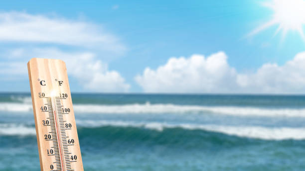 istock Thermometer with hot temperature on the beach 2154947952