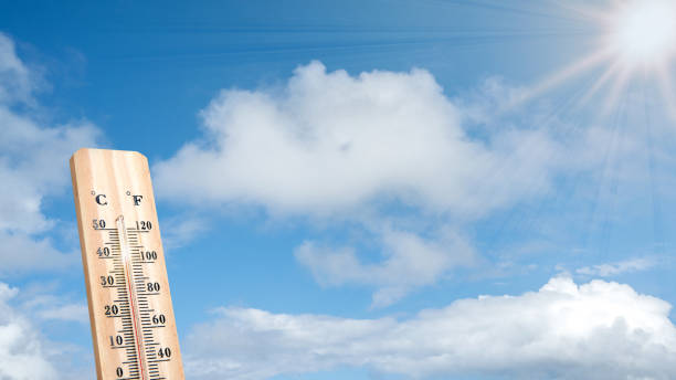 istock Thermometer with hot temperature with sky background 2154947958