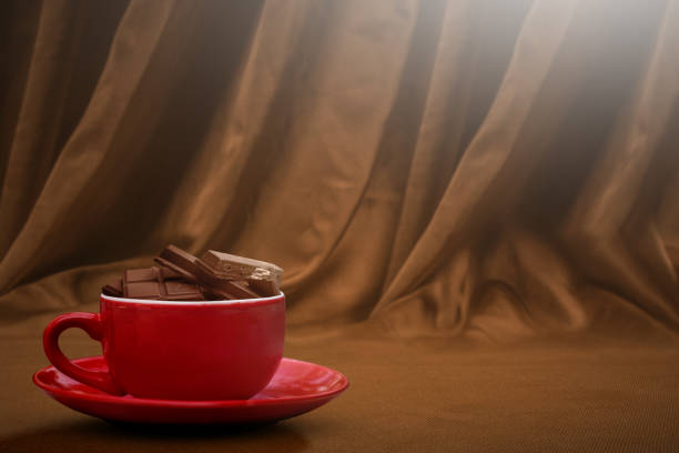 Young Caucasian woman enjoying a hot chocolate dessert in a vintage cafe during coffee break.
