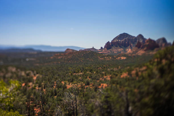 istock Desert mountain tilt shift with dark green forest and blue sky 2154949271