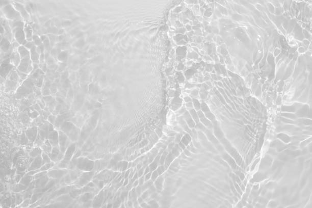 istock Blue water with ripples on the surface. Defocus blurred transparent blue colored clear calm water surface texture with splashes and bubbles. Water waves with shining pattern texture background. 2154949873