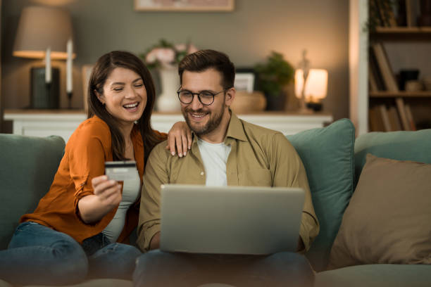 istock Couple shopping online at home. 2154952400