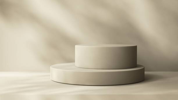 istock Two layers beige podium on counter, soft beautiful dappled sunlight, leaf shadow on brown texture wall 2154952403