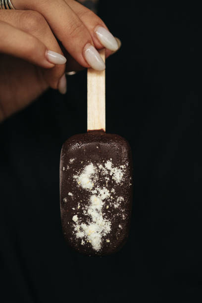 istock female hand is holding an ice cream eskimo 2154952592