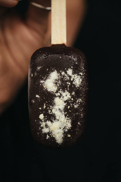 istock female hand is holding an ice cream eskimo 2154952597