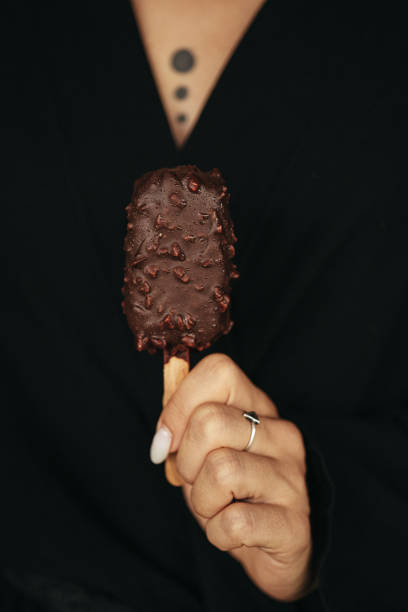 istock female hand is holding an ice cream eskimo 2154952603