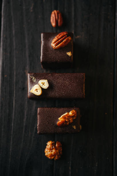 istock Halva in chocolate at dark background with nuts 2154952620