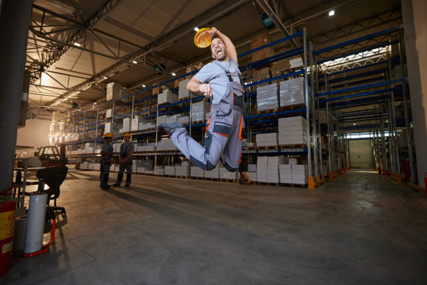 istock Cheerful male worker having fun in storage room. 2154960849