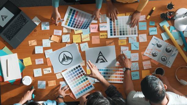 istock Top view of smart business team write graphic logo on meeting table. Symposium. 2154961061
