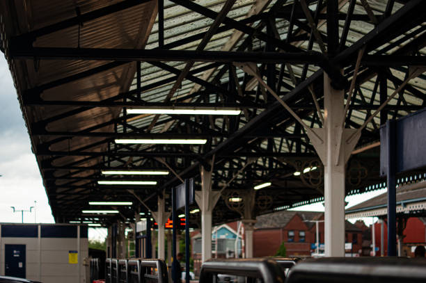 Metal bench seats on a railway station train platform