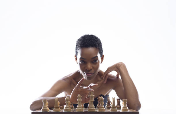 istock Sensual woman playing chess and touching the king 2154966787