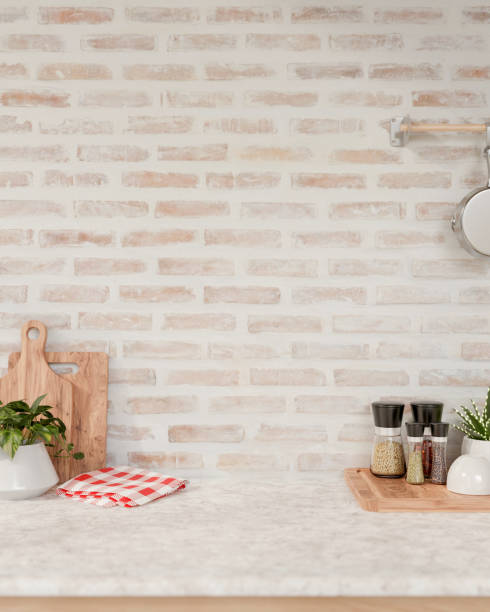 istock A space for displaying products on a white marble kitchen tabletop against the brick wall. 2154966788